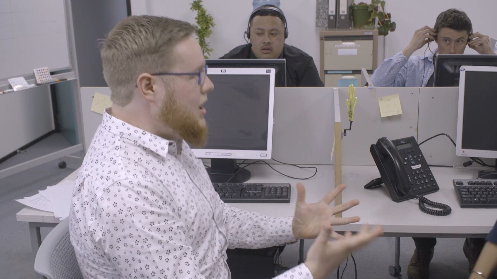 Mark Darbyshire doing enthusiastic, full-bodied vocal warm-ups in a call centre
